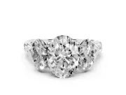 Oval Cut Diamond Three-Stone Ring Set in White gold with Braided Band