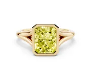 Fancy Yellow Bezel Set Radiant Cut Diamond Solitaire Ring Set in Yellow gold with Tapered Band