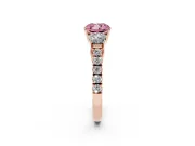 Fancy Pink Cushion Cut Diamond Three-Stone Ring Set in Rose gold with Round Side Stones and Delicate Pavé Band