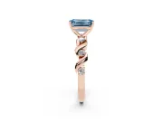Fancy Blue Emerald Cut Diamond Solitaire Ring Set in Rose gold with Ribbon Twist Band, Round Accents and Prong Setting