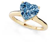 Fancy Blue Heart Cut Diamond Solitaire Ring Set in Yellow gold with Cathedral Band and Prong Setting