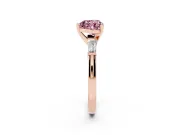 Fancy Pink Heart Cut Diamond Solitaire Ring Set in Rose gold with Tapered Baguette Side Stones and Prong Setting