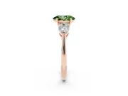 Fancy Green Three-Stone Oval Cut Diamond Ring Set in Rose gold with Pear Side Stones and Prong Setting