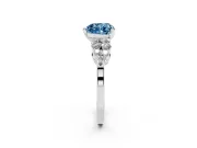 Fancy Blue Heart Cut Diamond Cluster Engagement Ring Set in White gold with Pavé Band and Prong Setting