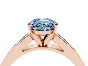 Fancy Blue Oval Cut Diamond Solitaire Ring Set in Rose gold with Channel-Set Band and Prong Setting