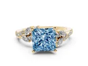 Fancy Blue Princess Cut Diamond Solitaire Ring Set in Yellow gold with Marquise Twist Band and Prong Setting