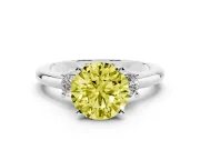 Fancy Yellow Three-Stone Round Cut Diamond Ring Set in Platinum with Prong Setting and Plain Band