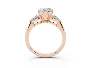 Three-Stone Heart Cut Diamond Ring Set in Rose gold with Pear Side Stones and Prong Setting