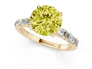 Fancy Yellow Round Cut Diamond Solitaire Set in Yellow gold with Side Baguettes and Channel Set Band