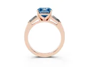 Fancy Blue Asscher Cut Diamond Solitaire Ring Set in Rose gold with Tapered Baguette Side Stones and Prong Setting