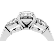 Three-Stone Emerald Cut Diamond Ring Set in Platinum with Pear Side Stones and Prong Setting
