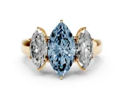 Fancy Blue Three-Stone Marquise Cut Diamond Ring Set in Yellow gold with Matching Prong Settings and Plain Band