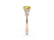 Fancy Yellow Three-Stone Princess Cut Diamond Ring Set in Rose gold with Pear Side Stones and Prong Setting