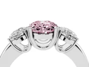 Fancy Pink Oval Cut Diamond Three-Stone Ring Set in Platinum with Polished Band and Prong Setting