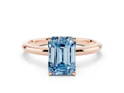 Fancy Blue Emerald Cut Diamond Solitaire Engagement Ring Set in Rose gold with Prong Setting and Polished Band