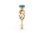 Fancy Blue Round Cut Diamond Solitaire Ring Set in Yellow gold with Side Stones on Criss-Cross Band and Prong Setting