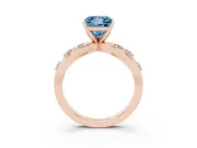 Fancy Blue Princess Cut Diamond Solitaire Ring Set in Rose gold with Side Stones on Criss-Cross Band and Prong Setting