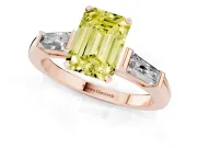 Fancy Yellow Emerald Cut Diamond Solitaire Ring Set in Rose gold with Tapered Baguette Side Stones and Prong Setting