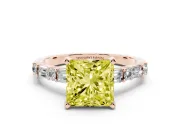 Fancy Yellow Princess Cut Diamond Solitaire Set in Rose gold with Side Baguettes and Channel Set Band