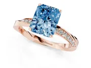 Fancy Blue Radiant Cut Diamond Engagement Ring Set in Rose gold with Side Stone Accents and Prong Setting