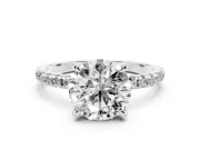 Round Cut Diamond Brilliant Solitaire Ring Set in White gold with Pavé Band and Prong Setting