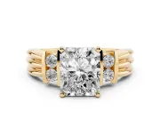Three-Stone Radiant Cut Diamond Channel Set Ring Set in Yellow gold with Bar Prongs
