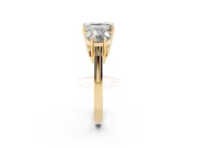 Emerald Cut Diamond Three-Stone Engagement Ring Set in Yellow gold with Polished Band