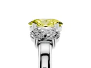 Fancy Yellow Oval Cut Diamond Three-Stone Ring Set in Platinum with Polished Band and Prong Setting