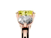 Fancy Yellow Oval Cut Diamond Three-Stone Ring Set in Rose gold with Prong Setting and Classic Band