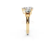 Pear Cut Diamond Three-Stone Ring Set in Yellow gold with Round Accent Stones and Plain Band