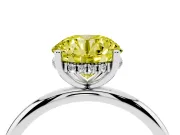 Fancy Yellow Round Cut Diamond Solitaire Engagement Ring Set in White gold with Prong Setting and Polished Band