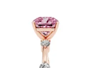 Fancy Pink Cushion Cut Diamond Solitaire Ring Set in Rose gold with Bezel Set Side Stones and Prong Setting