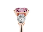 Fancy Pink Three-Stone Princess Cut Diamond Ring Set in Rose gold with Pear Side Stones and Prong Setting