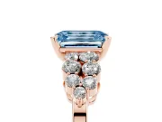 Fancy Blue Emerald Cut Diamond Cluster Engagement Ring Set in Rose gold with Pavé Band and Prong Setting