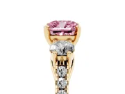 Fancy Pink Three-Stone Cushion Cut Diamond Pavé Band Ring Set in Yellow gold with Prong-Set Trio