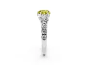 Fancy Yellow Heart Cut Diamond Three-Stone Ring Set in White gold with Pavé Band