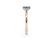 Fancy Blue Emerald Cut Diamond Solitaire Ring Set in Rose gold with Prong Setting on a Polished Plain Band
