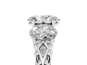 Oval Cut Diamond Three-Stone Ring Set in Platinum with Braided Band