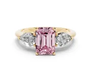 Fancy Pink Three-Stone Emerald Cut Diamond Ring Set in Yellow gold with Pear Side Stones and Prong Setting