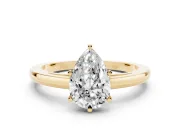 Pear Cut Diamond Solitaire Engagement Ring Set in Yellow gold with Prong Setting on a Classic Band