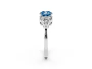 Fancy Blue Cushion Cut Diamond Solitaire Ring Set in White gold with Cluster Accents on Each Side