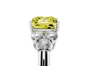 Fancy Yellow Princess Cut Diamond Cluster Ring Set in Platinum with Round Accent Stones and Prong Setting on a Plain Band
