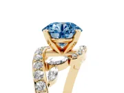 Fancy Blue Round Cut Diamond Solitaire Ring Set in Yellow gold with Pavé Twist Band and Secure Prong Setting