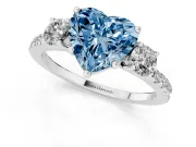 Fancy Blue Heart Cut Diamond Three-Stone Ring Set in Platinum with Pavé Band and Graduated Sides