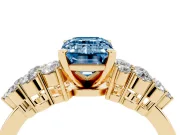 Fancy Blue Emerald Cut Diamond Cluster Engagement Ring Set in Yellow gold with Pavé Band and Prong Setting