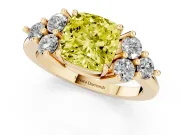 Fancy Yellow Cushion Cut Diamond Solitaire Ring Set in Yellow gold with Cluster Accents on Each Side