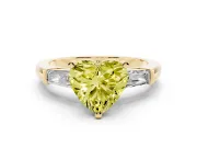 Fancy Yellow Heart Cut Diamond Solitaire Ring Set in Yellow gold with Tapered Baguette Side Stones and Prong Setting