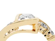 Radiant Cut Diamond Bezel Bypass Ring Set in Yellow gold with Round Accents