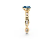 Fancy Blue Heart Cut Diamond Twist Band Solitaire Ring Set in Yellow gold with Leaf Prong Setting and Accent Stones