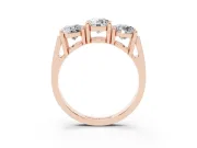 Round Cut Diamond Three-Stone Ring Set in Rose gold with Channel Band and Sturdy Prongs